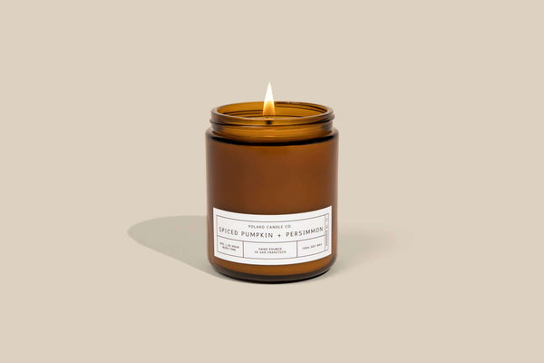 Cozy spiced pumpkin candle with persimmon, exuding warm, inviting aromas for fall vibes. Perfect for a festive atmosphere.
